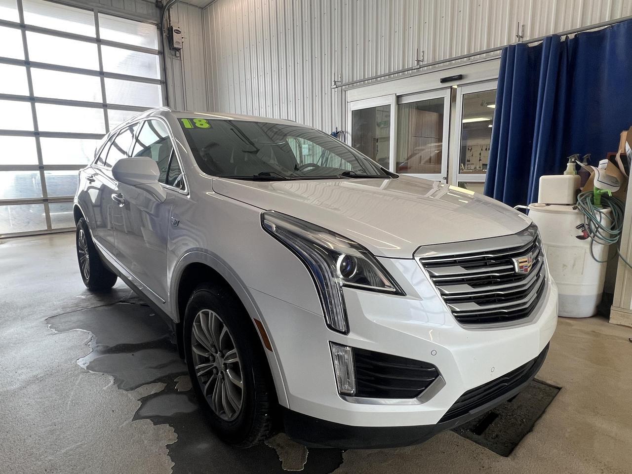 If youre looking for a refined, capable luxury SUV with a thoughtful feature set, this 2018 Cadillac XT5 Luxury AWD delivers exactly that. Finished in striking Crystal White Tricoat over a Black interior, it pairs a twin-clutch all-wheel drive system with a smooth 3.6L V6 and a host of upscale features that make every drive genuinely enjoyable  whether youre commuting or heading out of town.

- Twin-clutch AWD system with driver mode select for confident, responsive handling in all conditions
- Power UltraView double-sized glass sunroof  one of the largest in its class, opening over the first row for an airy, open feel
- Heated leather-wrapped steering wheel and 8-way power passenger seat with 2-way lumbar support for long-haul comfort
- Adaptive Remote Start so the cabin is ready before you are
- Side Blind Zone Alert and Rear Cross-Traffic Alert for added confidence in traffic and parking lots
- Front and Rear Park Assist plus a Rear Vision Camera to make tight spaces stress-free
- Built-in 4G LTE Wi-Fi hotspot capable of connecting up to 7 devices  great for families or frequent travelers
- Power-folding, heated side mirrors with auto-dimming driver side and rear power liftgate with programmable height memory

At 124,500 km, this XT5 has been well used but offers exceptional value in the luxury SUV segment. Visit Merit Ford Sales to experience it in person  book a test drive appointment, reach out with any questions, or get started on your purchase online. Were here to make the process straightforward and worthwhile.